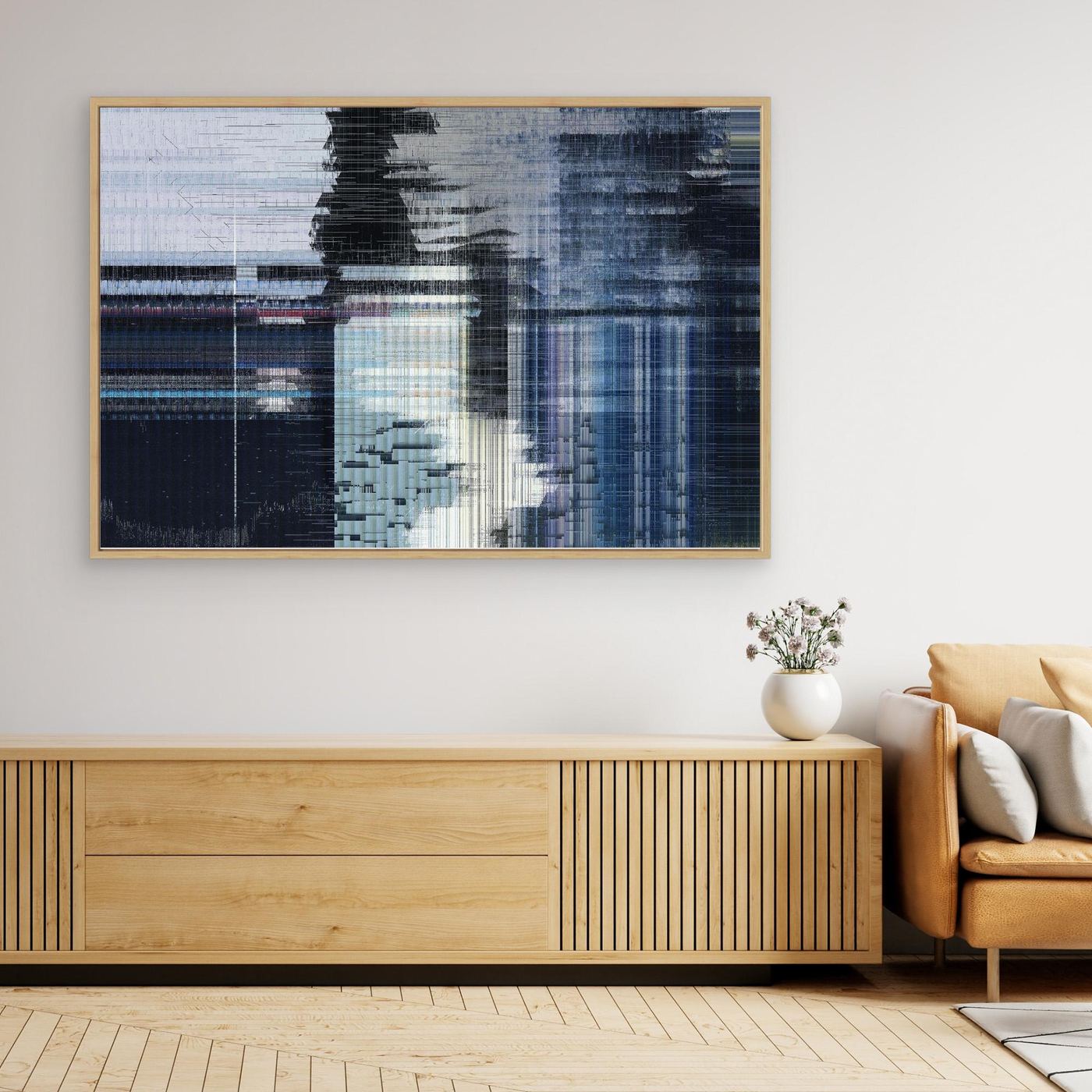 Abstract art piece on a wall above a wooden console table in a living room for sale