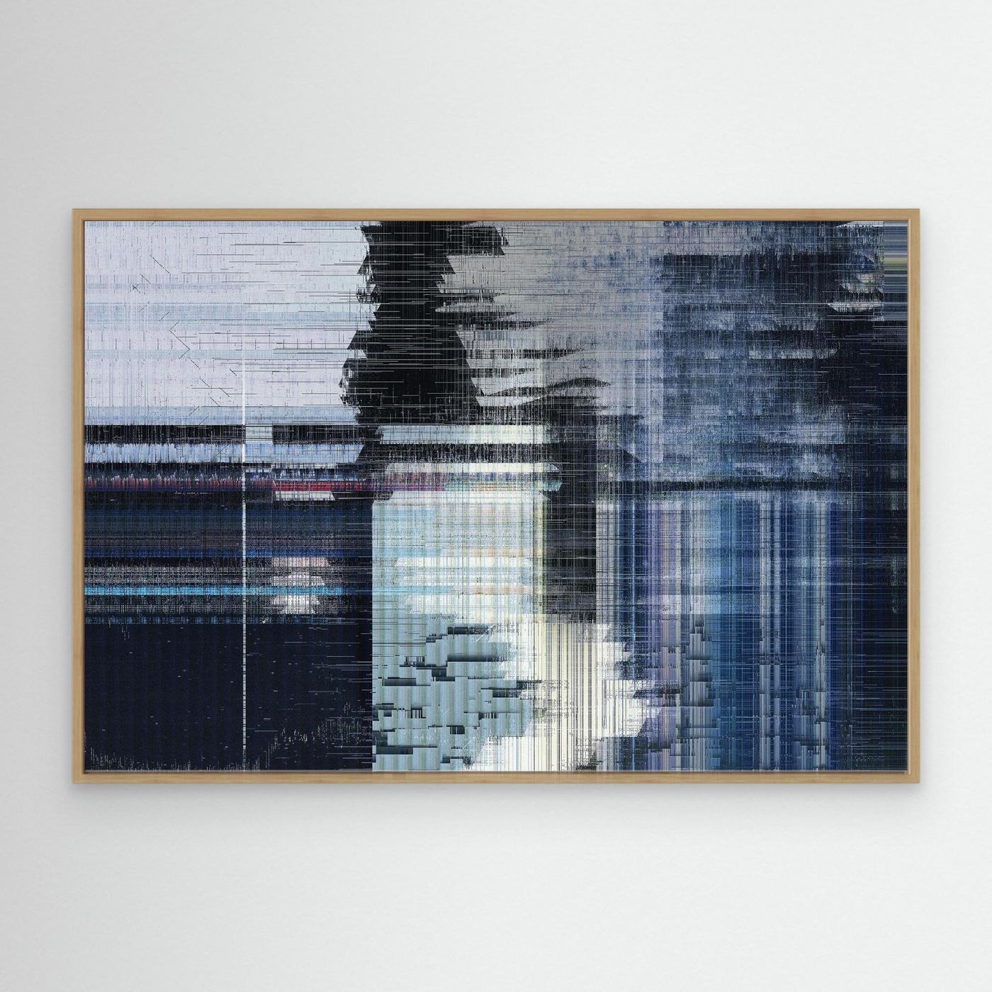 Abstract glitch art piece with blue and black patterns in a wooden frame on a white wall to buy