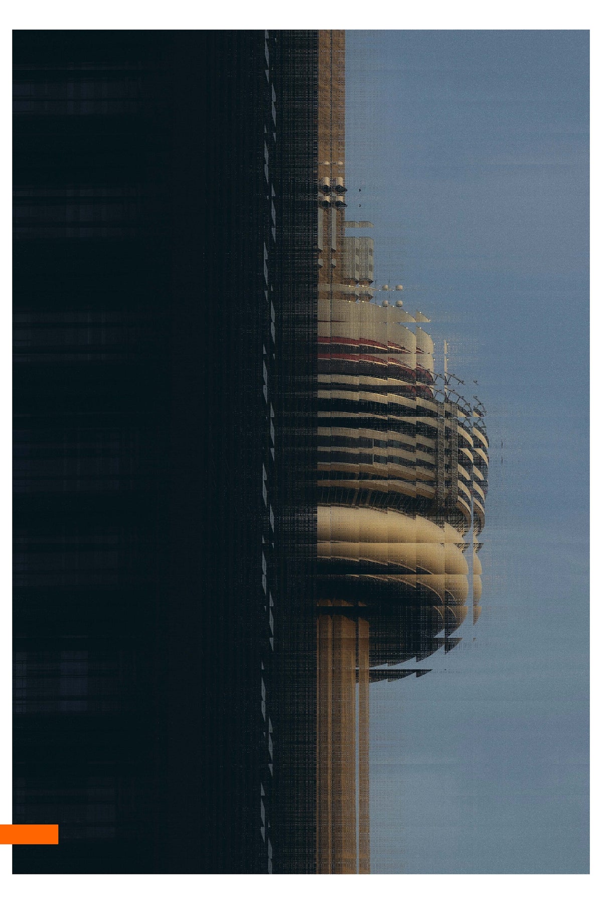 A square architectural photograph of a modern skyscraper with the CN tower in the background, shown in dark shadow against a pale blue sky.