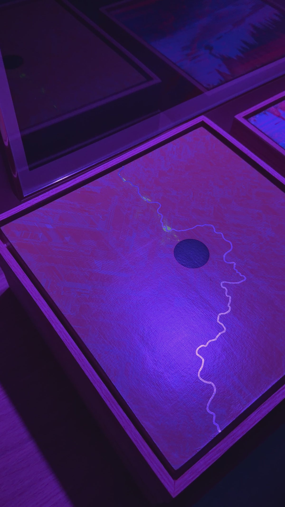 Video of the glitched artwork under a black light
